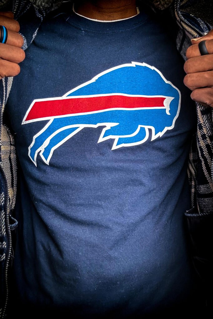 Photo of Man Wearing Buffalo Bills Sports Logo Shirt